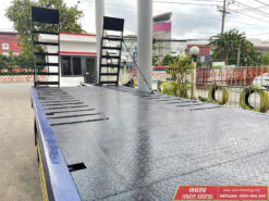 xe Isuzu NQR 550 5 tấn nâng đầu chở máy công trình