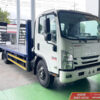 xe Isuzu NQR 550 5 tấn nâng đầu chở máy công trình